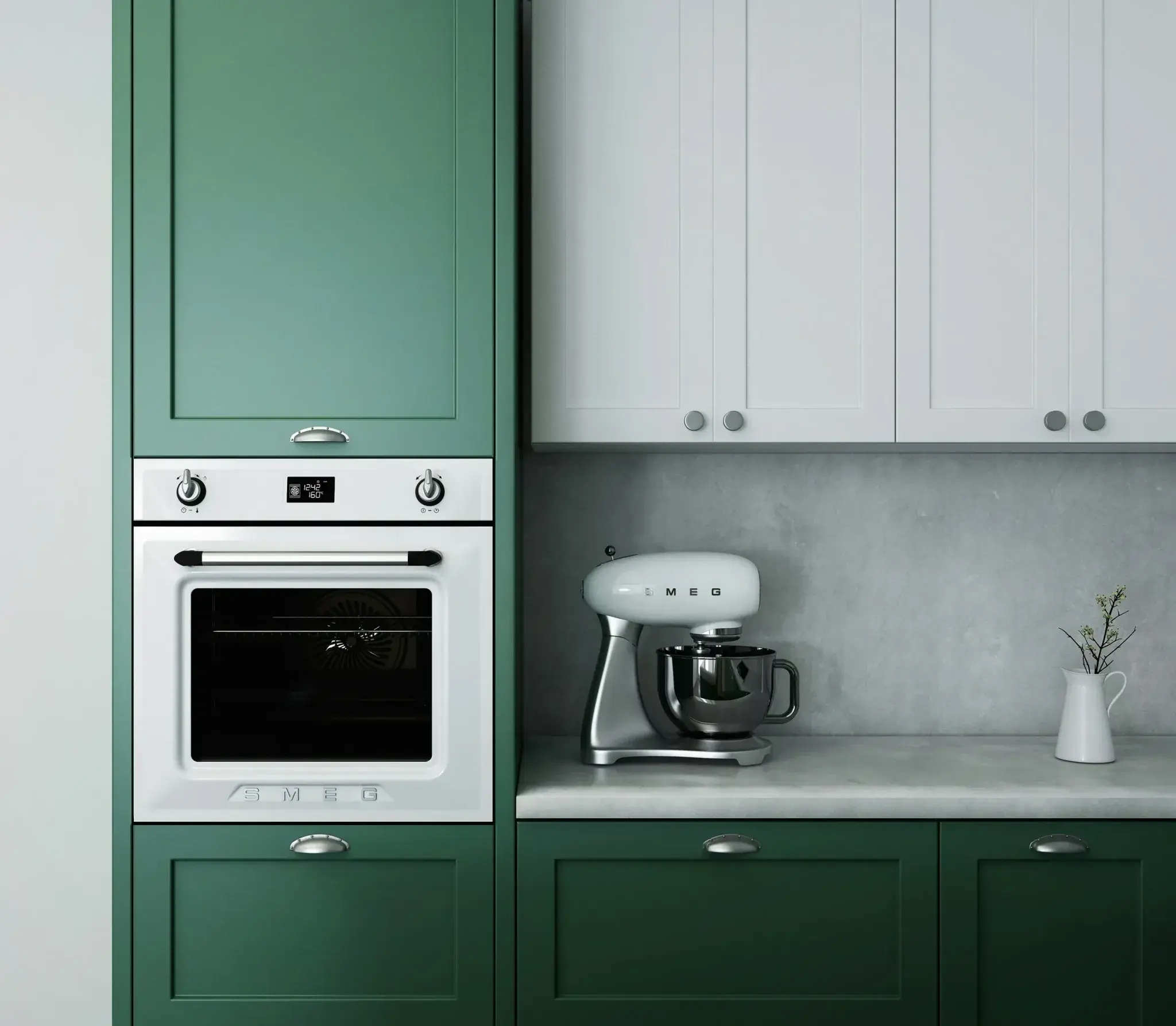 A white built-in electric oven set into dark green kitchen cabinetry